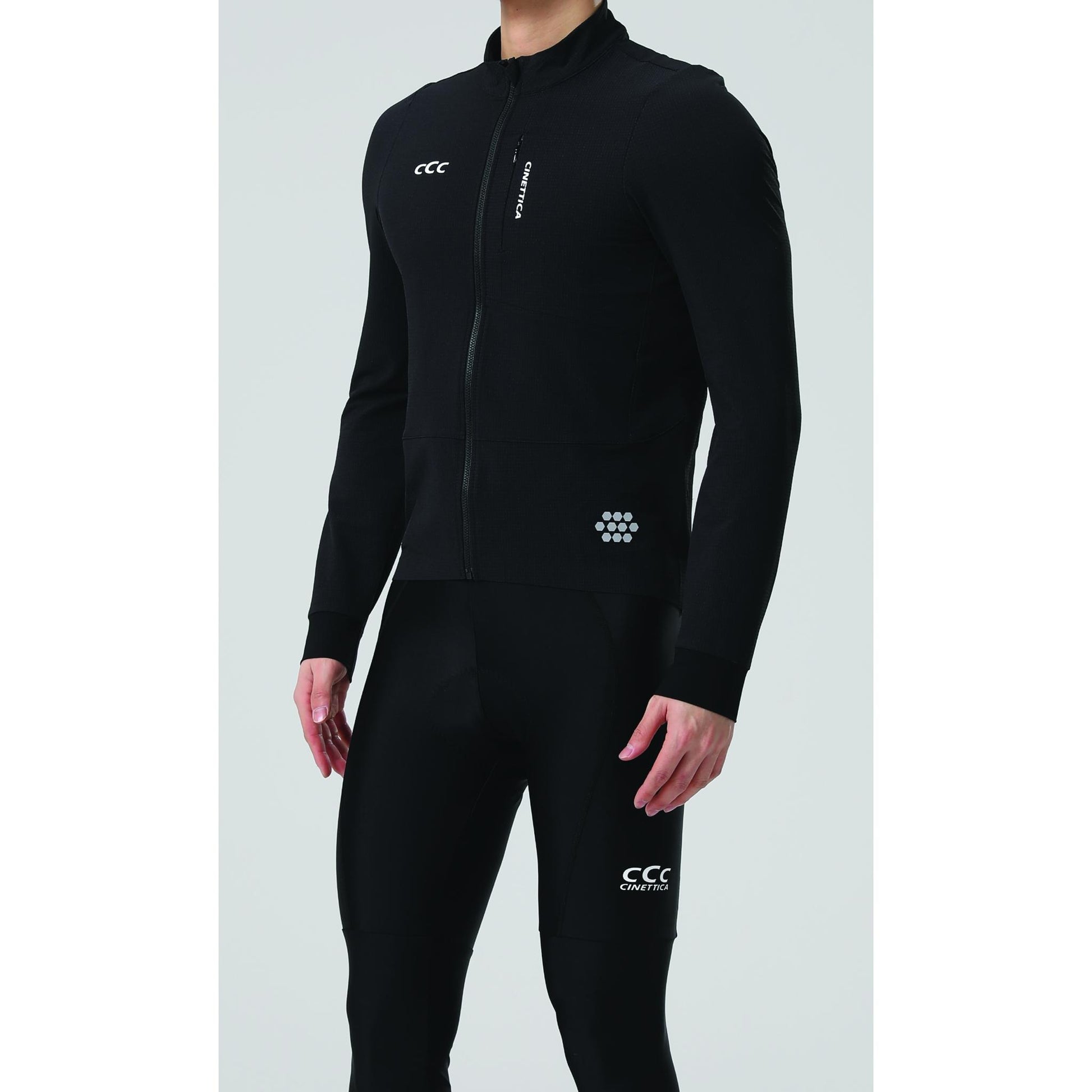 Cinettica Vincita black cycling jacket and tights with reflective details, full zip, and long sleeves.
